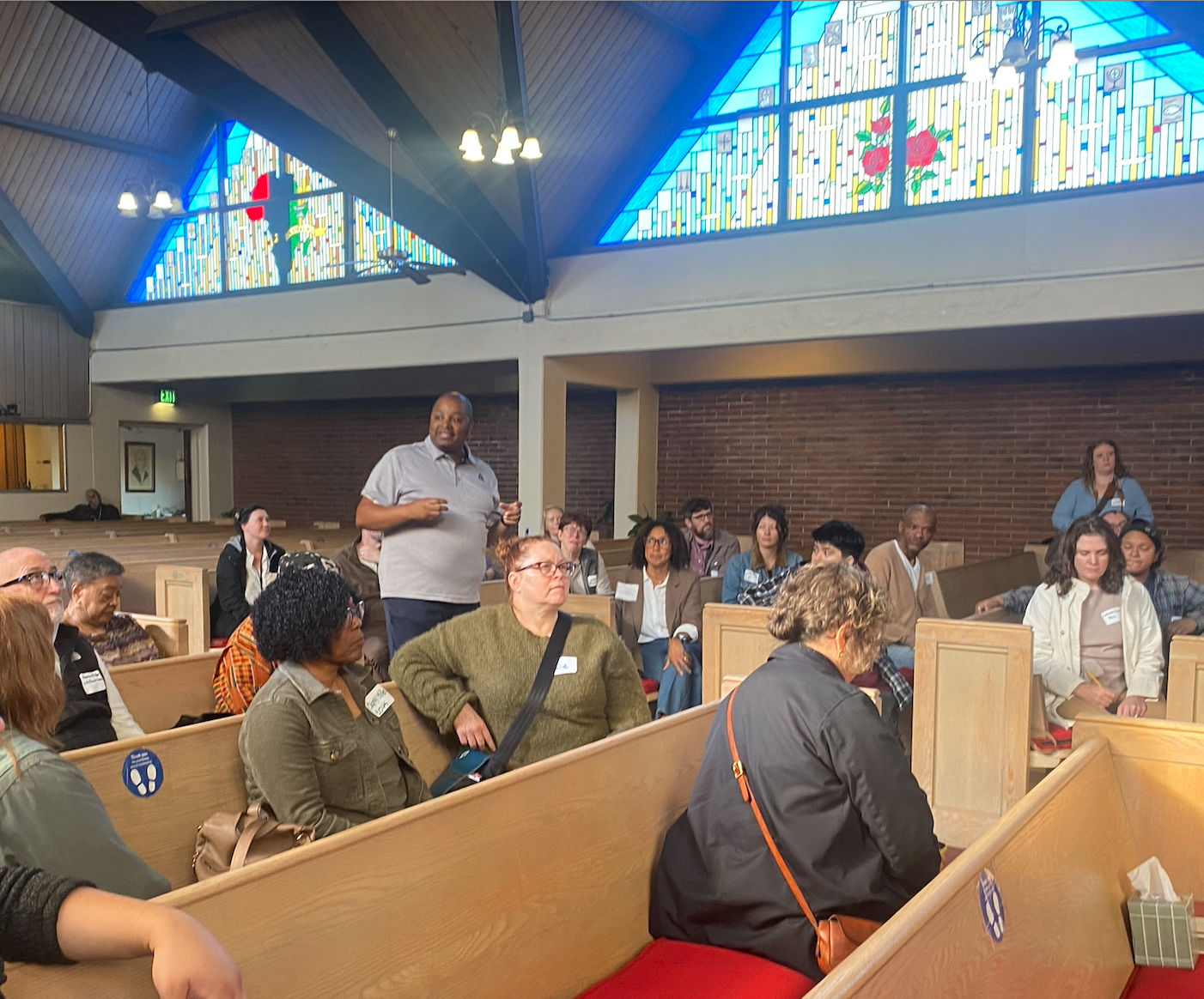 Pastor Ross talking to the guests on the Albina Church Tour